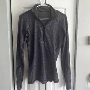 Lululemon 1/4 running shirt. Great for base layer with hand warmer in sleeves.
